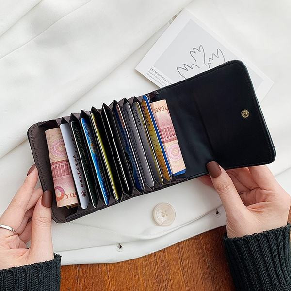 Γυναικείο έκο δερμάτινο πορτοφόλι με μεταλλική διακόσμηση σε τέσσερα χρώματα