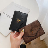 Γυναικείο πορτοφόλι με μεταλλική διακόσμηση