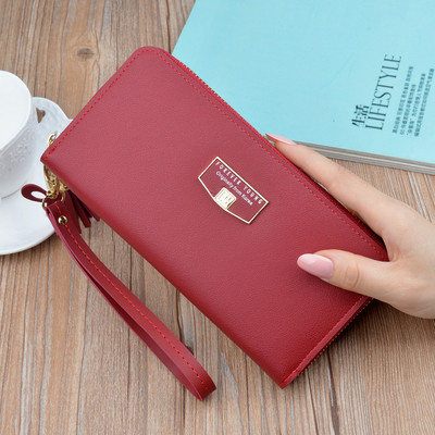 Γυναικείο μοντέρνο πορτοφόλι με κοντή λαβή και φούντα