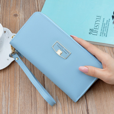 Γυναικείο μοντέρνο πορτοφόλι με κοντή λαβή και φούντα