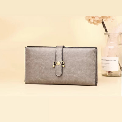 Γυναικείο πορτοφόλι από οικολογικό δέρμα με κούμπωμα