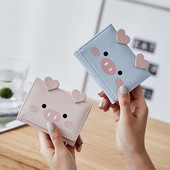 Μικρό γυναικείο πορτοφόλι με τρισδιάστατο στοιχείο και μεταλλική στερέωση