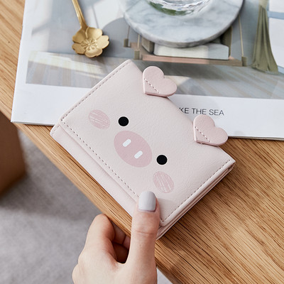 Μικρό γυναικείο πορτοφόλι με τρισδιάστατο στοιχείο και μεταλλική στερέωση