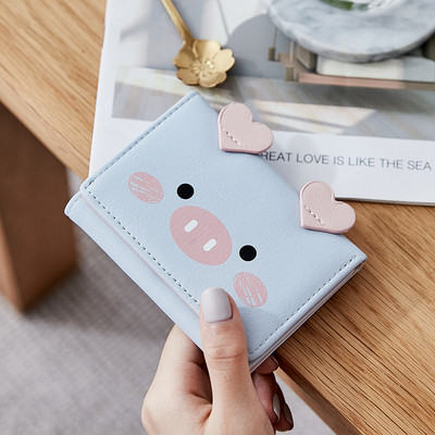 Μικρό γυναικείο πορτοφόλι με τρισδιάστατο στοιχείο και μεταλλική στερέωση