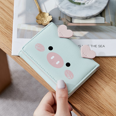 Μικρό γυναικείο πορτοφόλι με τρισδιάστατο στοιχείο και μεταλλική στερέωση