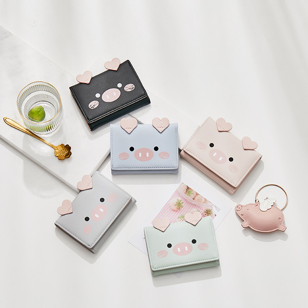 Μικρό γυναικείο πορτοφόλι με τρισδιάστατο στοιχείο και μεταλλική στερέωση