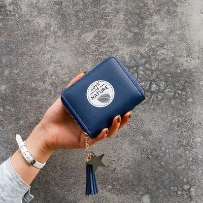 Γυναικείο έκο δερμάτινο πορτοφόλι με φερμουάρ και μενταγιόν