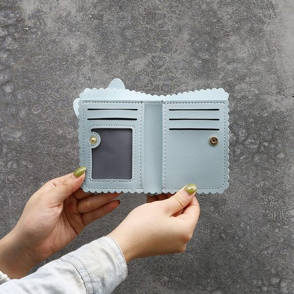 Γυναικείο πορτοφόλι από οικολογικό δέρμα με τρισδιάστατα στοιχεία