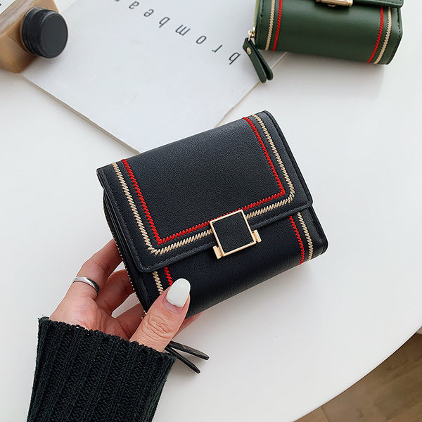 Γυναικείο έο δερμάτινο πορτοφόλι με μεταλλική στερέωση