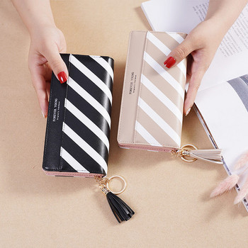 Стилен дамски портфейл с пискюл и цип в два цвята