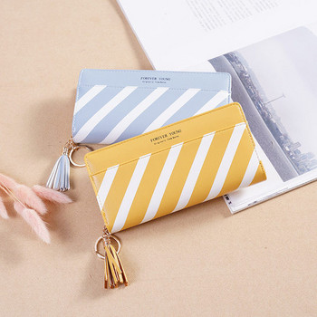 Стилен дамски портфейл с пискюл и цип в два цвята
