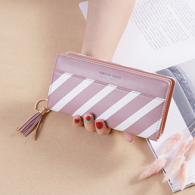 Κομψό γυναικείο πορτοφόλι με φούντα και φερμουάρ σε δύο χρώματα