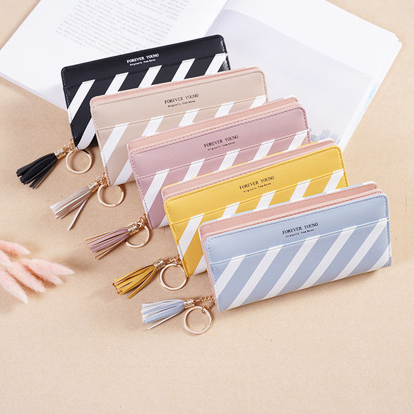 Κομψό γυναικείο πορτοφόλι με φούντα και φερμουάρ σε δύο χρώματα