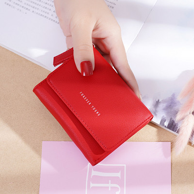 Μικρό γυναικείο πορτοφόλι με φερμουάρ και επιγραφή