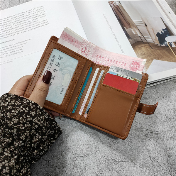 Γυναικείο καρό πορτοφόλι από οικολογικό δέρμα σε καφέ μπλε και μαύρο χρώμα