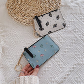 Γυναικείο πορτοφόλι με φερμουάρ και απλικέ