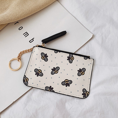 Γυναικείο πορτοφόλι με φερμουάρ και απλικέ