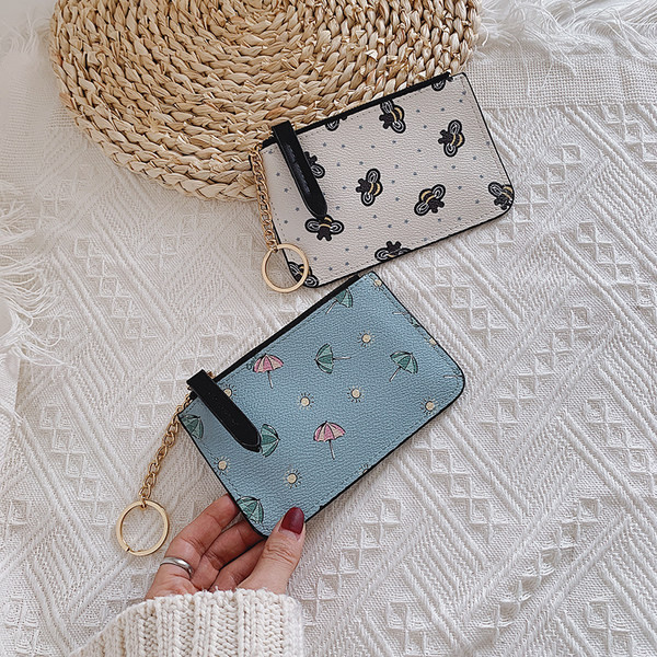 Γυναικείο πορτοφόλι με φερμουάρ και απλικέ