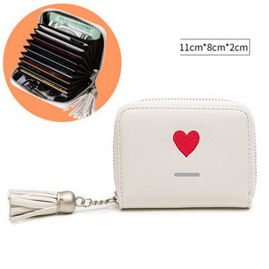 Μικρό γυναικείο πορτοφόλι από οικολογικό δέρμα για έγγραφα με φούντα