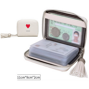 Μικρό γυναικείο πορτοφόλι από οικολογικό δέρμα για έγγραφα με φούντα