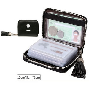 Μικρό γυναικείο πορτοφόλι από οικολογικό δέρμα για έγγραφα με φούντα