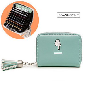 Μικρό γυναικείο πορτοφόλι από οικολογικό δέρμα για έγγραφα με φούντα