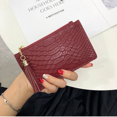 Sieviešu ādas somiņa ar rāvējslēdzēju un pušķi