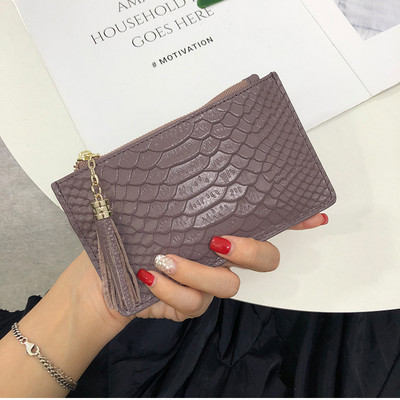 Sieviešu ādas somiņa ar rāvējslēdzēju un pušķi