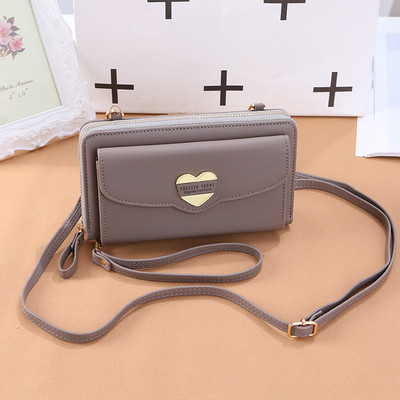 Νέο μοντέλο γυναικείο πορτοφόλι με δύο θήκες και μεταλλική διακόσμηση