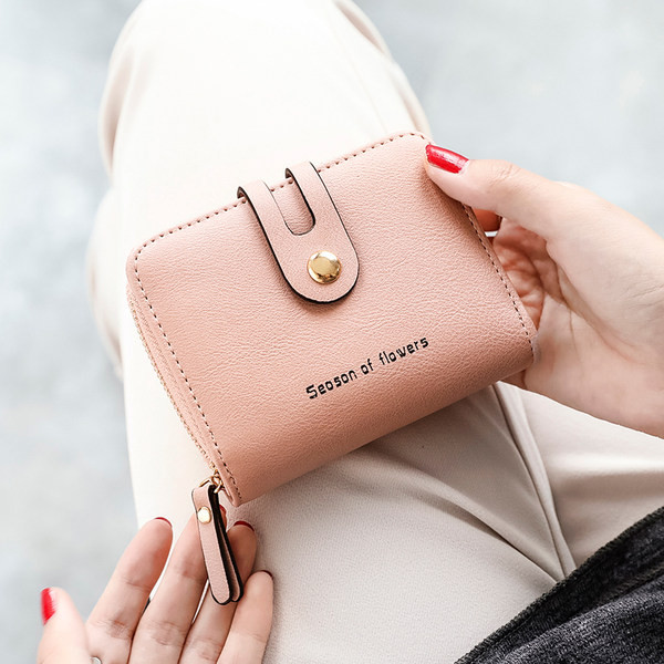 Mazs sieviešu maciņš ar vairākiem nodalījumiem - eko āda