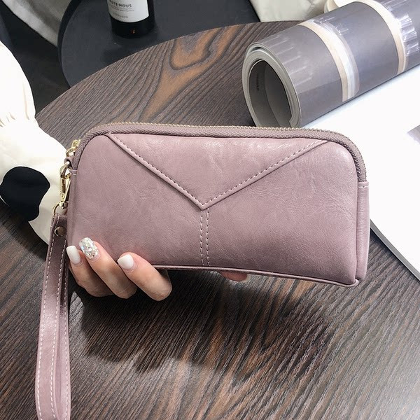 Sieviešu maks ar rokturi un rāvējslēdzēju