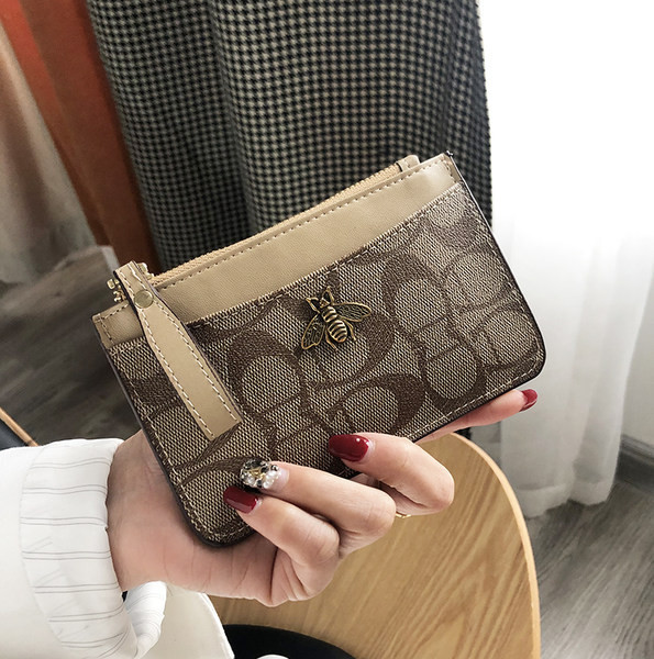 Mini portofel de dama cu fermoar si decor metalic