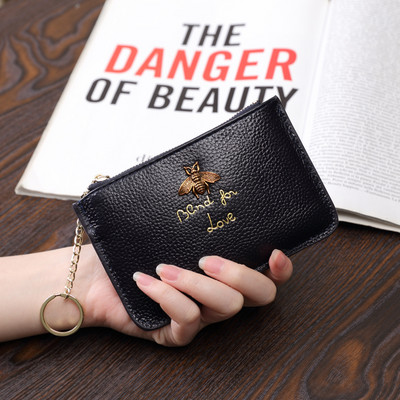 Sieviešu maks no eko ādas ar metāla apdari - ar rāvējslēdzēju