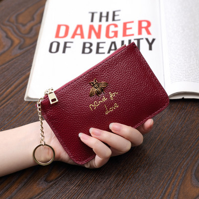 Sieviešu maks no eko ādas ar metāla apdari - ar rāvējslēdzēju