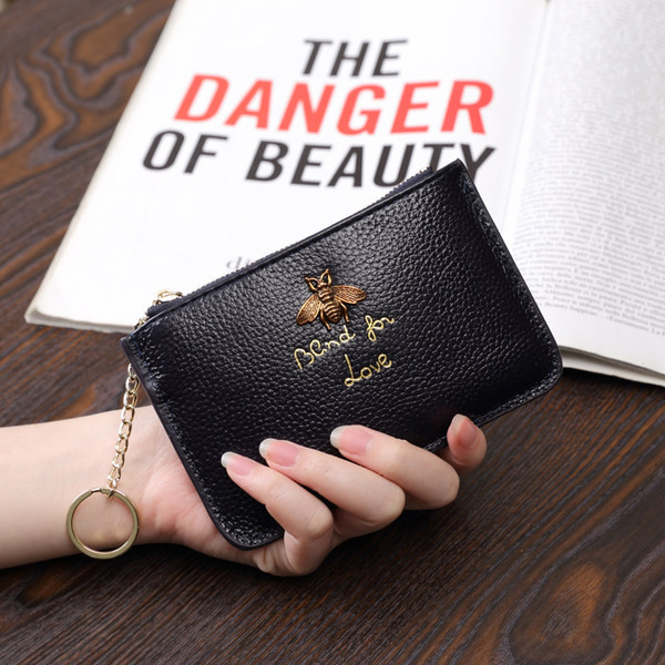 Sieviešu maks no eko ādas ar metāla apdari - ar rāvējslēdzēju