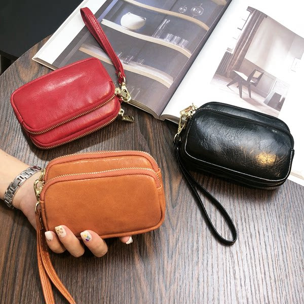 Sieviešu maks ar rāvējslēdzēju un rokturi