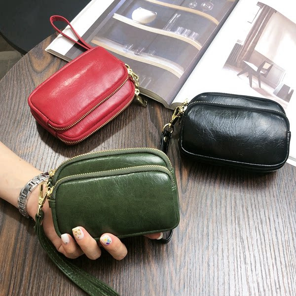 Sieviešu maks ar rāvējslēdzēju un rokturi