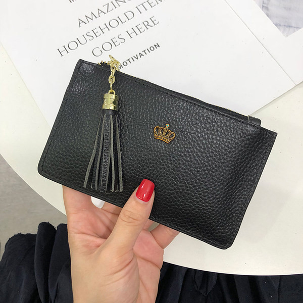 Portofel de dama din piele cu decor metalic si ciucuri