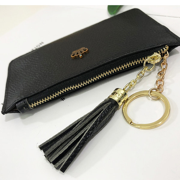 Portofel de dama din piele cu decor metalic si ciucuri