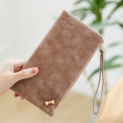 Garš sieviešu maks ar metāla apdari un īsu rokturi