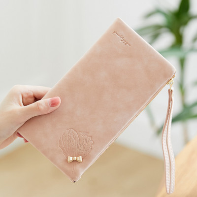 Garš sieviešu maks ar metāla apdari un īsu rokturi