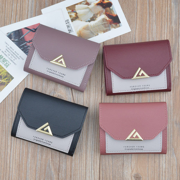 Maža moteriška piniginė su metaliniu užsegimu ir debeto kortelių skyreliais