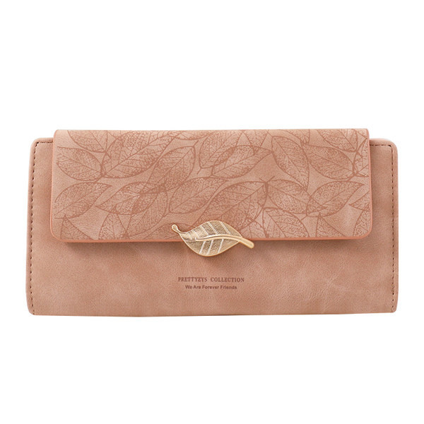 Didelė moteriška piniginė su užrašu ir metaline puošmena