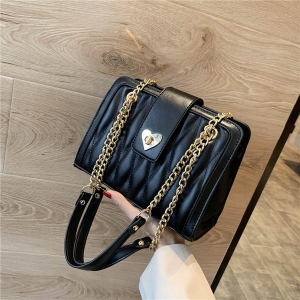 Geantă modernă de damă din piele, cu mâner metalic lung