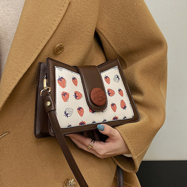 Jauns sieviešu somas modelis ar aplikāciju divās krāsās