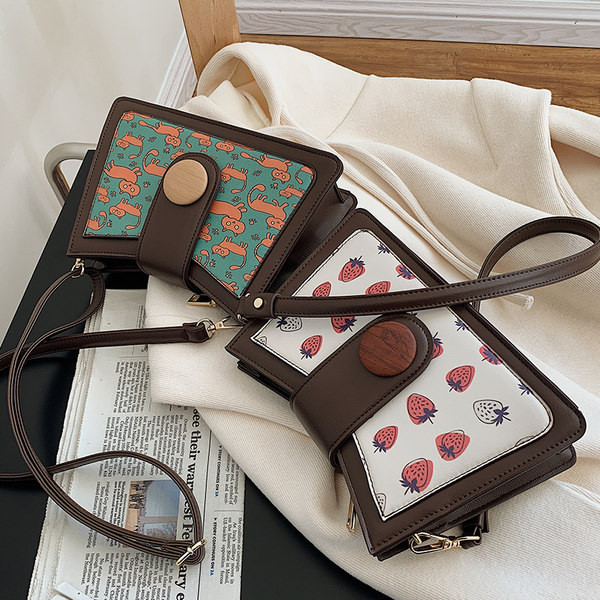 Jauns sieviešu somas modelis ar aplikāciju divās krāsās