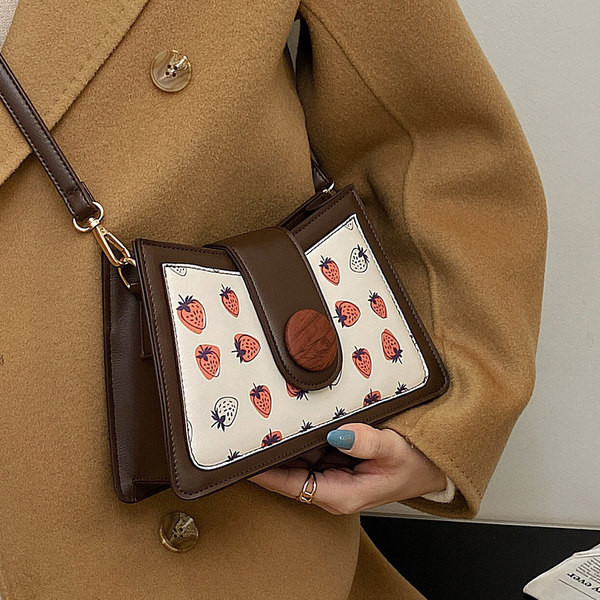 Jauns sieviešu somas modelis ar aplikāciju divās krāsās