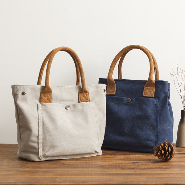 Ženska platnena torba s prednjim džepom i ručkom