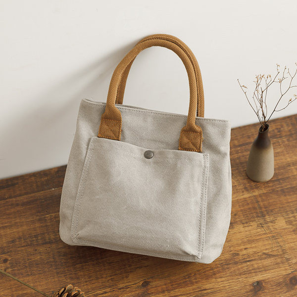 Ženska platnena torba s prednjim džepom i ručkom