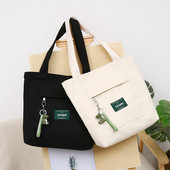 Sieviešu audekla soma ar priekšējo kabatu un plecu rokturiem